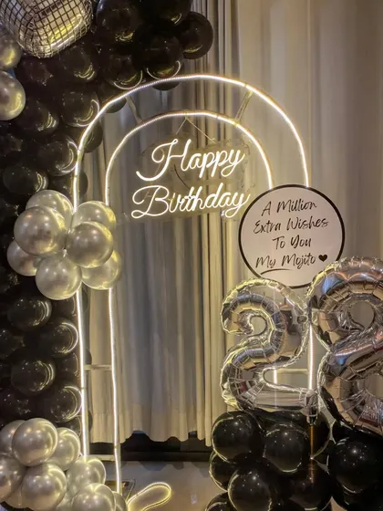 Another shot of the 28th birthday decor, highlighting the large foil numbers and the sleek, celebratory design.