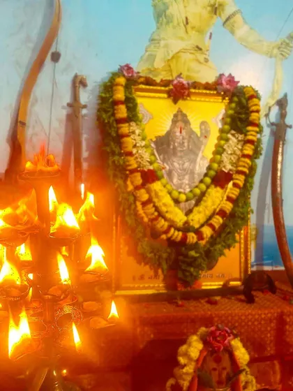 The warm glow of diyas illuminates the deity during the Ayudha Puja. This light represents the divine spark that we seek to awaken within ourselves through the practice of Dhanurvidya.