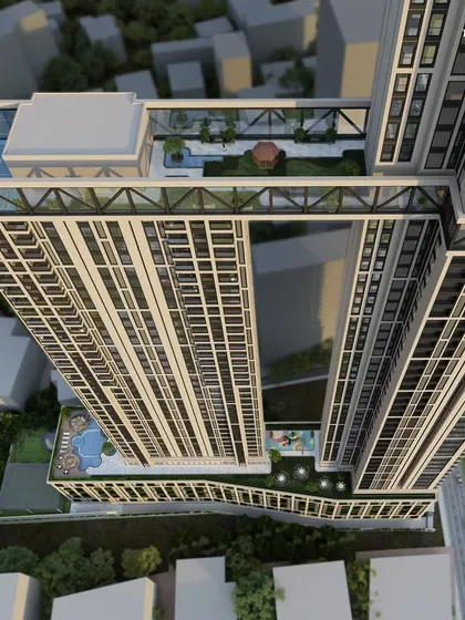 An aerial perspective of the twin towers in South Mumbai, revealing the magnificent Sky Deck that connects them. This elevated oasis includes a walking track and paddle courts, offering residents an exclusive space for leisure and wellness.