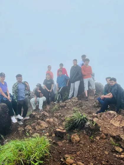 A group photo from a misty day on a Chikmagalur trek.