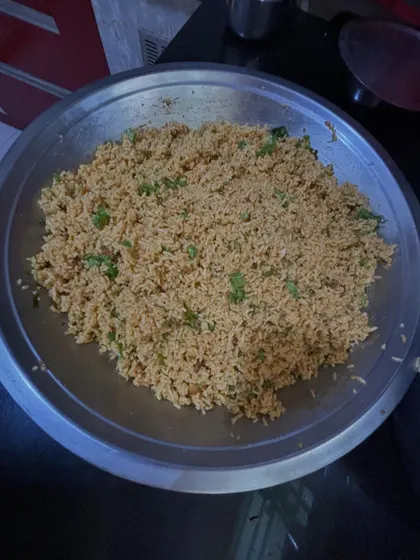 Preparing authentic Puliogare, a tangy tamarind rice, completely from scratch. This involves roasting and grinding the special Puliogare masala powder myself.