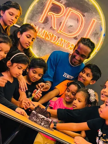A beautiful moment from our Children's Day celebration, with all the kids gathered around the cake with their instructor. These events strengthen the bond between our students and teachers.