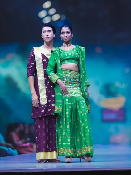 This image from Bangalore Fashion Week showcases a bold contrast in colors with traditional Indian designs. My aim was to capture the models' strong presence and the rich textures of the green and purple fabrics.