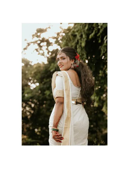 A beautiful over-the-shoulder shot of the bride, her expression full of joy.