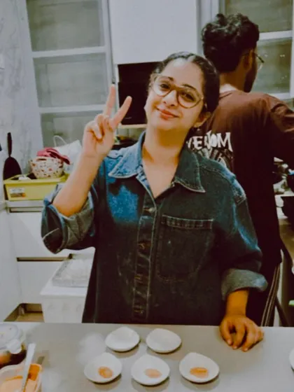 A candid shot of me in the kitchen. The journey has had its highs and lows, but I'm grateful for every moment and the support of my family.