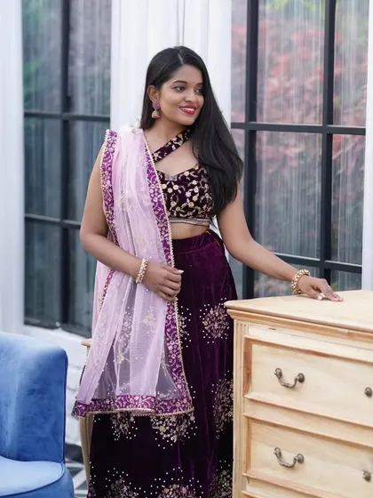 The elegant design of this purple lehenga, with its contrasting pink dupatta, makes it a standout choice for any pre-wedding event or photoshoot.