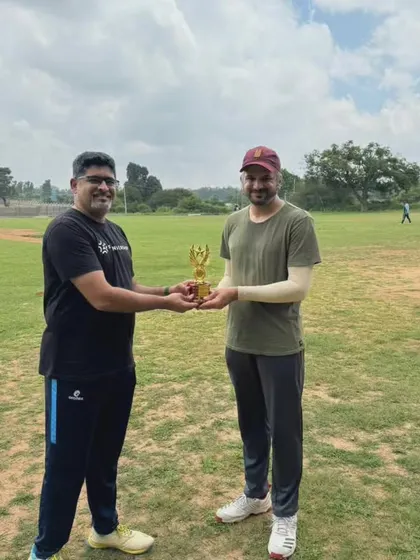 A player being presented with an award for his performance. Individual recognition is an important part of our team culture.