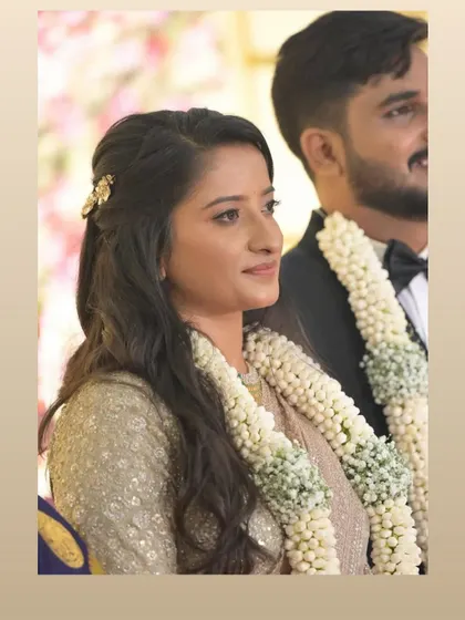 A beautiful candid shot of a client during her ceremony. She looks serene and confident, fully present in her special moment.