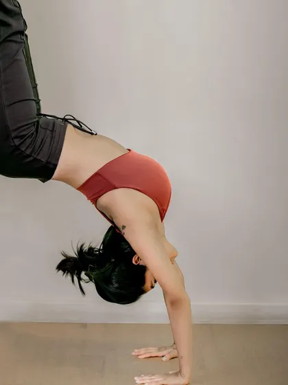 Preparing for a handstand with some L-shaped hops in the studio. This drill is fantastic for building the core engagement and muscle memory required for inversions.