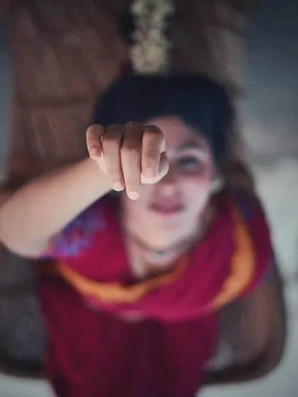 An artistic shot with a focused hand gesture, blurring the background. This photo plays with perception, a theme I am constantly exploring in my work.