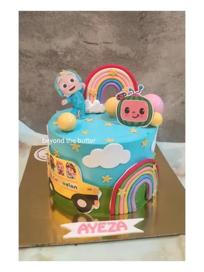 A sweet and simple CoComelon cake with rainbows and the iconic yellow bus. It's a smaller version that's perfect for more intimate family celebrations.
