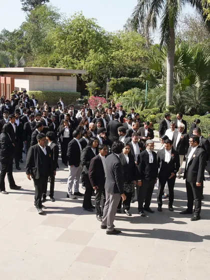 A wide shot of our supporters gathered outside the court. Together we stand, and together we will rise. This image represents the collective strength of our legal community and the choice we have to vote for progress and integrity.