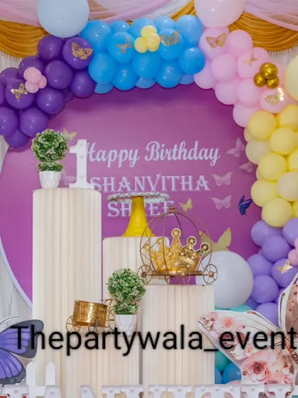 A close-up of the purple butterfly theme, showing the detailed backdrop and props.