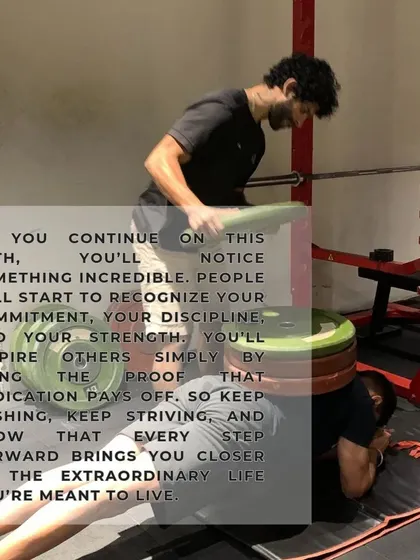 Assisting a client with a weighted sit-up. As you continue on this path, your discipline and strength will inspire others.