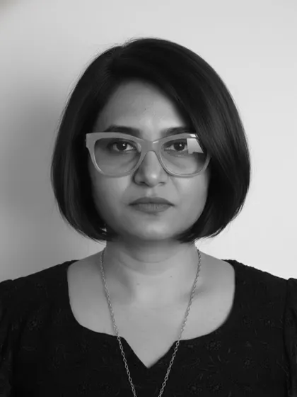 A direct, powerful portrait in black and white, where the sharp lines of the bob haircut take center stage.
