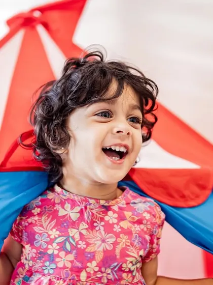 The pure joy of playing in a circus tent. I love capturing the uninhibited laughter and imagination of toddlers during our sessions.