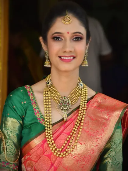 A bright and happy portrait of the bride-to-be. Her makeup is kept simple and elegant, with a focus on clean skin and a pretty pink lip.