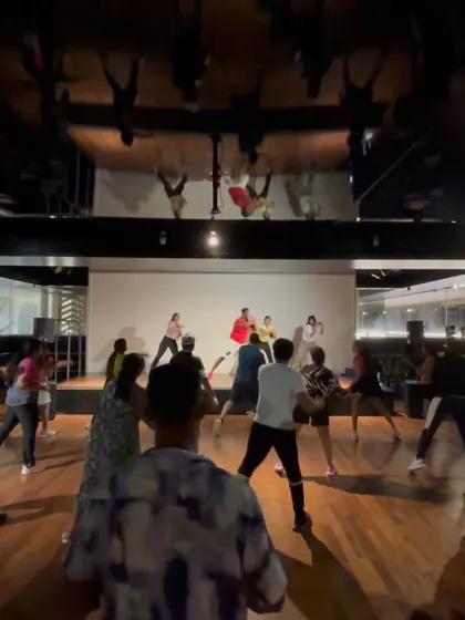 A wide shot of the dance event, showing the great turnout and high energy.