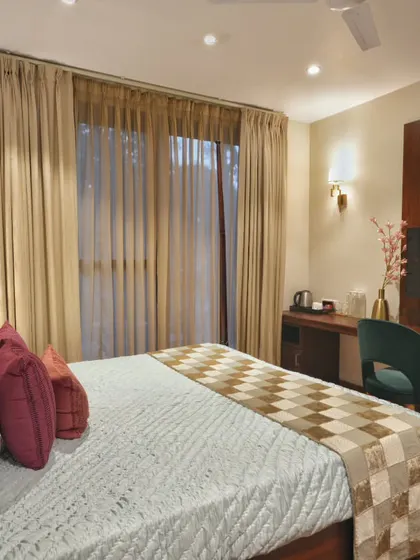 This angle shows the functional layout of the homestay bedroom, including a dedicated work desk and TV unit. We ensured that every element, from the furniture to the lighting, contributes to a cohesive and high-end guest experience.