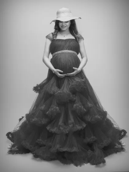 Feeling like a queen in this stunning black and white shot, featuring a dramatic ruffled gown and a chic hat.