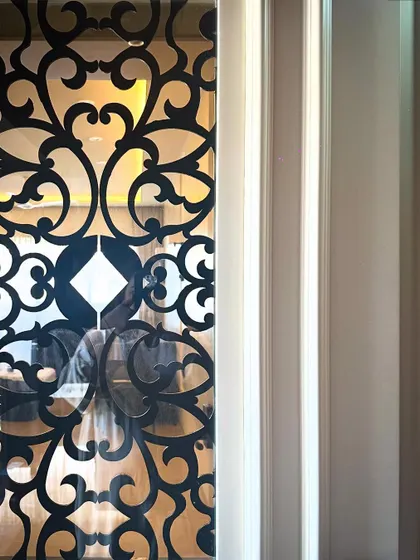 This intricate metal jali is not just beautiful, it's functional. We designed it as part of a safety door, with a small opening to communicate or pass parcels without opening the entire door.