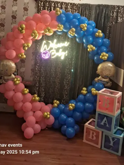 A slightly different angle of the pink and blue "Welcome Baby" setup, showing how it looks in a home environment.