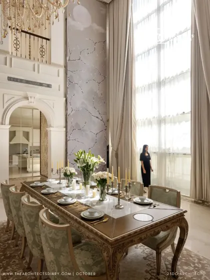 A moment of quiet contemplation in the dining room of The Ivory Royale. The towering window floods the space with light, highlighting the delicate wallpaper and the sheer scale of the room.