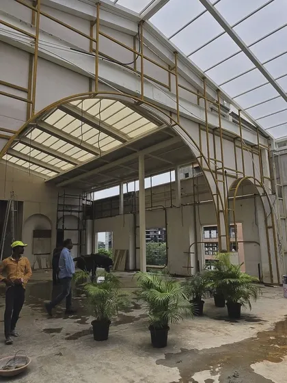 The metal framework for arches being installed at a commercial project, showing how we build our signature elements.