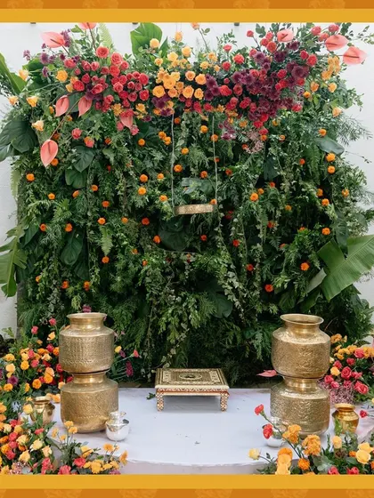 A duplicate of the stunning Haldi backdrop, emphasizing the vibrant colors and lush texture of the floral wall.