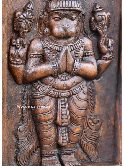 Another close-up of the Hanuman Kavadi, focusing on the texture and finish of the wood.