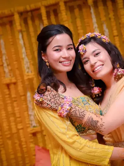 Sisters sharing a warm hug during the Haldi ceremony. This photo captures the special bond and the shared happiness of the occasion.