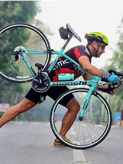 A member showing his strength by lifting his Bianchi bike. It's a classic cyclist pose that we love.
