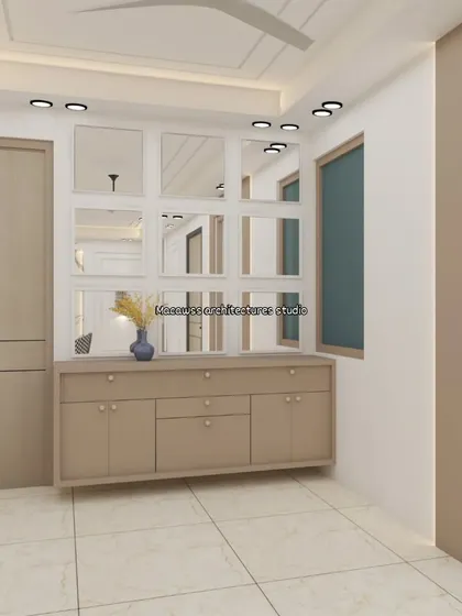 This image shows a floating console table with a grid of mirrors above it. This is a design strategy I use to enhance light and create a sense of spaciousness in dining or entryway areas.
