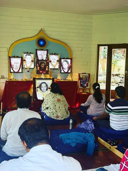 Meditators sit in stillness before the altar of our masters. Group meditation is a cornerstone of our path, as Paramhansa Yogananda taught that "environment is stronger than willpower."