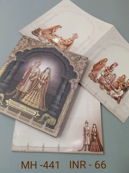 A grand invitation featuring a royal couple under a beautifully decorated arch. The card has a 3D quality and includes inserts with matching traditional artwork.