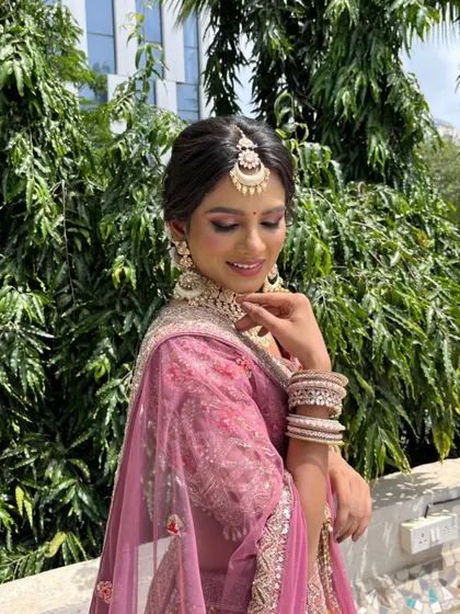 A serene and beautiful pose. The soft makeup and elegant attire make for a truly timeless sangeet or cocktail look.