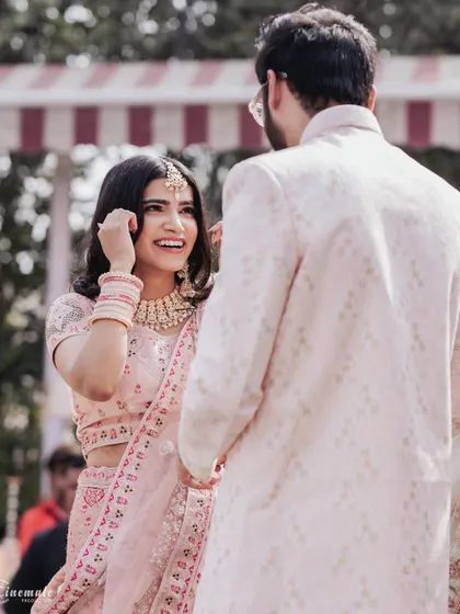 A beautiful, candid interaction between the couple, filled with smiles and genuine affection.