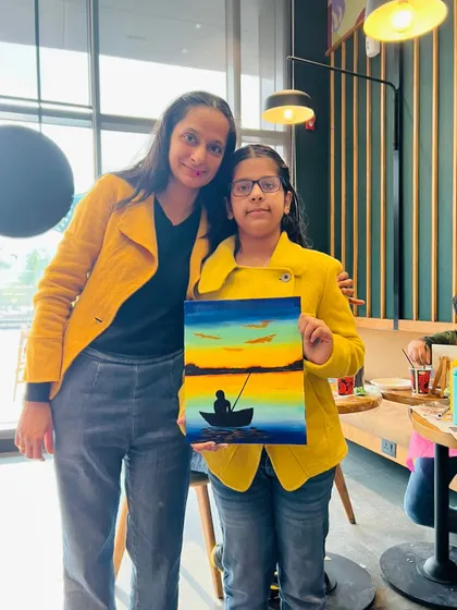 Another mother-daughter duo with their beautiful sunset painting.