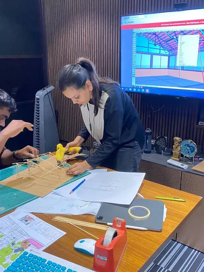 Collaboration is key. Here, my team is working with structural engineers from Space Structures, using physical and digital models to refine the roof design for the Kaivalyam reception block.