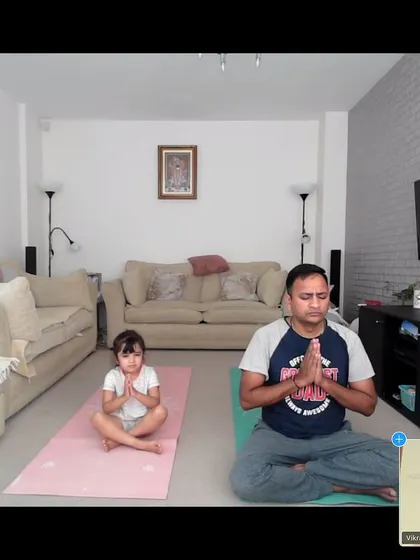 We love seeing families practice together. Here, a father and his young daughter share a moment of peace during an online yoga session with one of our instructors.