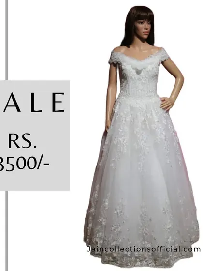 A classic white off-shoulder gown, perfect for a pre-wedding shoot or cocktail party, on sale for Rs. 3500.