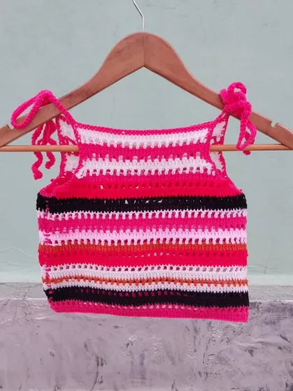 Another view of the custom striped halter top, hanging to show its full design.