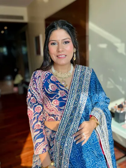 Fresh and minimal for this client in a beautiful blue printed lehenga. The makeup is clean and radiant.