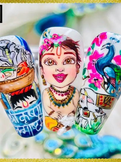 A wider view of the Janmashtami nail art set, showing three distinct, detailed designs that tell a story across the nails.