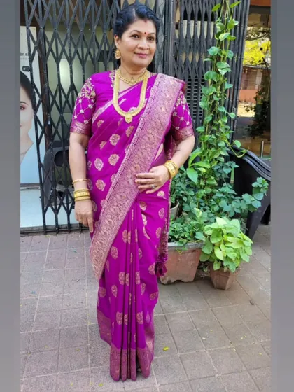 My favorite muse, my teacher. It is always an honor to drape her, and this time it was in a beautiful purple silk saree with an embroidered blouse.