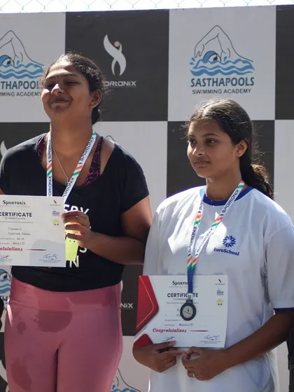 Swimmers celebrating their achievements on the podium during the Sportonix Anniversary Cup 2024.