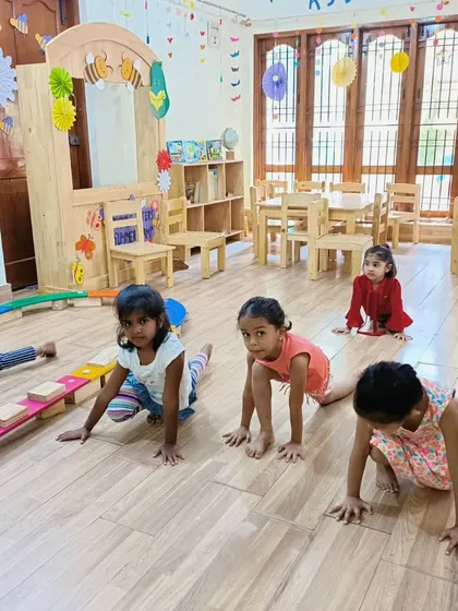 A group of campers doing the "bear walk" during a movement session. This activity builds upper body strength and coordination.