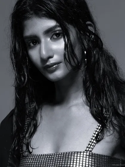 A black and white close-up from the "wet look" series, with a direct and engaging gaze.