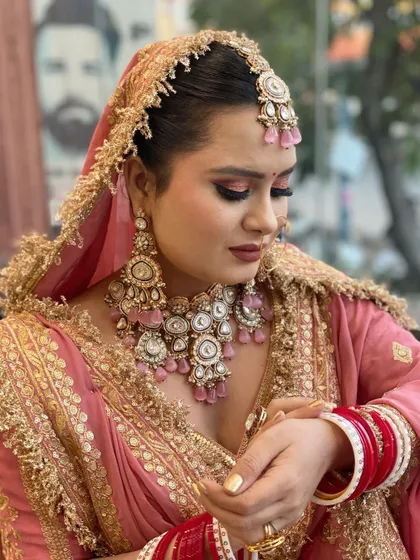A closer look at this stunning bride in her pink and gold lehenga. I gave her a classic golden nail polish on her extensions to perfectly match the intricate work on her outfit. Bridal nails are the final touch that completes the entire look.