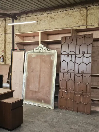We believe the story of a home begins long before the final reveal. This is our workshop, where custom panels and ornate details await installation. This stage of patience and precision is where our design philosophy truly takes shape.